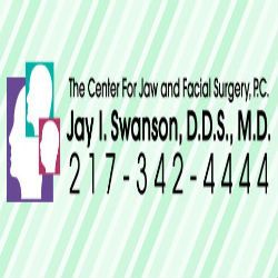 Silhouettes of heads with text: "The Center for Jaw and Facial Surgery, P.C., Jay I. Swanson, D.D.S., M.D."