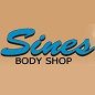 Blue "Sines Body Shop" logo on a tan background.