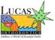Lucas Orthodontics logo with colorful design, palm tree, and the text "EmBrace A World Of Beautiful Smiles."