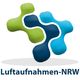Logo mit grünen und blauen Elementen, darunter steht "Luftaufnahmen-NRW".