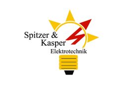 Logo von Spitzer & Kasper Elektrotechnik: Glühbirne mit Sonne und Blitzsymbol.