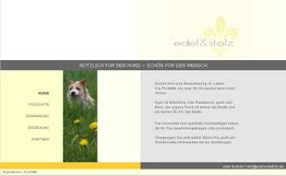 Webseite für Hundeprodukte, mit einem Hund auf einer Wiese und Menüleiste links.