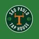 Logotipo circular verde com texto "São Paulo Tap House" em branco e torneiras de chope laranja.