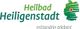 Logo: "Heilbad Heiligenstadt – mittendrin erleben!" mit stilisierter Deutschlandkarte und rotem Punkt.