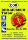 Plakat des DDR-Museums Tutow mit Logo, Adresse und Kontaktinformationen auf gelbem Hintergrund.