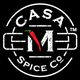 Logo of Casa M Spice Co with a red chili pepper forming the letter M, on a black background.