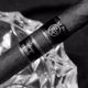 Cigar labeled "Vintage 1992" in an ashtray, black and white photo.