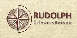 Kompassrose und Schriftzug "RUDOLPH ErlebnisReisen" auf beigem Hintergrund.