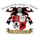 Escudo de la Escuela de Hostelería y Turismo La Capellanía, con símbolos culinarios.