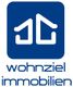 Logo von "wohnziel immobilien" mit stilisierten Hausdächern in einem blauen Quadrat.
