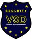 Blaues Schild mit gelben Sternen, "SECURITY VSD" und "Vereinte SicherheitsDienste".