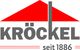 Logo mit rotem Dach und dem Text "KRÖCKEL seit 1886" in Grau.