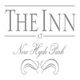 Text logo reading "The Inn at New Hyde Park" with decorative swirls below.