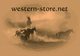 Cowboys treiben Pferde im Staub an; Schriftzug "western-store.net" oben.