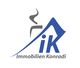 Logo von Immobilien Konradi mit stilisiertem Dach und einem „iK“ in Blau.