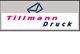 Logo mit Text "Tillmann Druck" und einem stilisierten Briefumschlag-Symbol oben.