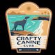 Logo of Crafty Canine Club with a dog by the sea, palm trees, and mountains in the background.