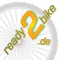 Graues Fahrrad-Rad im Hintergrund, Text "ready 2 bike .de" in Orange und Grün.