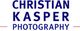 Logo mit dem Text „CHRISTIAN KASPER PHOTOGRAPHY“ in blauer Schrift.