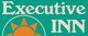 Sign reading "Executive Inn" with a sun icon on a teal background.