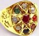 Gold ring with nine colorful gemstones arranged in a star pattern.