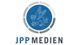 Logo von JPP Medien mit geflügeltem Löwen in einem blauen Kreis.
