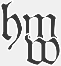 Gothische Buchstaben "hm" und "w" auf grauem Hintergrund.