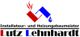 Logo mit rotem und blauem Symbol: "Installateur- und Heizungsbaumeister Lutz Lehnhardt".