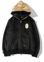 Black zip-up hoodie with gold hood and emblem, featuring front pockets and a badge design.