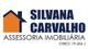 Logotipo da Silvana Carvalho, uma casa laranja e preta com o texto: "Assessoria Imobiliária".
