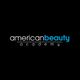 Logo reading "American Beauty Academy" on a black background, with "beauty" in blue.
