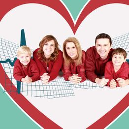 Family in red sweaters lying down inside heart shape with ECG line in background.