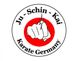 Logo von Ju-Schin-Kai Karate Germany mit Faust und rot-weißem Hintergrund.