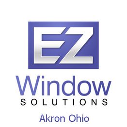 Logo of EZ Window Solutions in Akron, Ohio with a purple and white design.