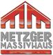 Logo mit rotem Hausdach und Schriftzug "Metzger Massivhaus" in grauen Großbuchstaben.