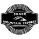 Logo of Silver Mountain Express with mountain graphic and tire tread border.