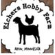 Silhouette of a goat with a chicken on its back, text reads "Eichers Hobby Farm, Avon, MN".