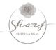 Logo grigio con rosa, testo "Shary Estetica & Relax" in cerchio. Stile elegante e semplice.