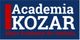 Texto: "Academia KOZAR, Mejor Academia de Cataluña" en fondo azul con franja roja.