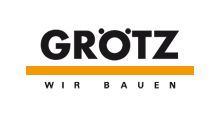Logo von "GRÖTZ" mit gelbem Streifen darunter, der Text "Wir bauen" darunter in Schwarz.
