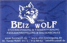 Blaues Logo mit Wolf und Text: "BEIZ WOLF, Stuckreinigung, Fassadenreinigung, Bautenschutz".