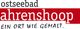 Logo mit Text "ostseebad ahrenshoop" und Slogan "Ein Ort wie gemalt" auf rotem Hintergrund.