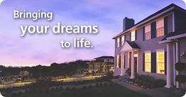 House at sunset with glowing windows and the text "Bringing your dreams to life."