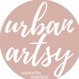 "Urban artsy logo in white script on a pink circle; 'Nashville Mayfield' at the bottom."